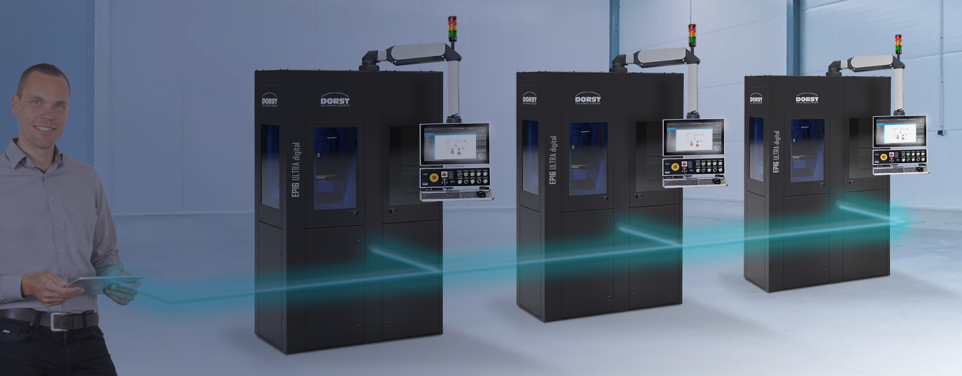 DORST Technologies employee with tablet monitoring three networked EP16 ULTRA digital presses
