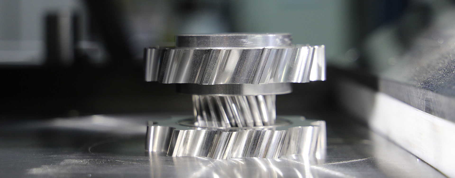 Close-up of stacked helical gears made from pressed metal powder