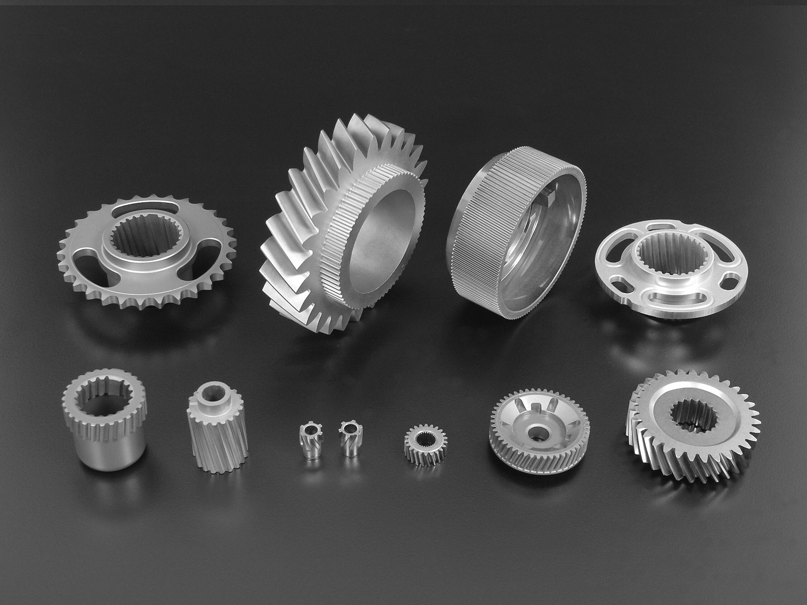 Various helical gears and cogwheels made from pressed metal powder